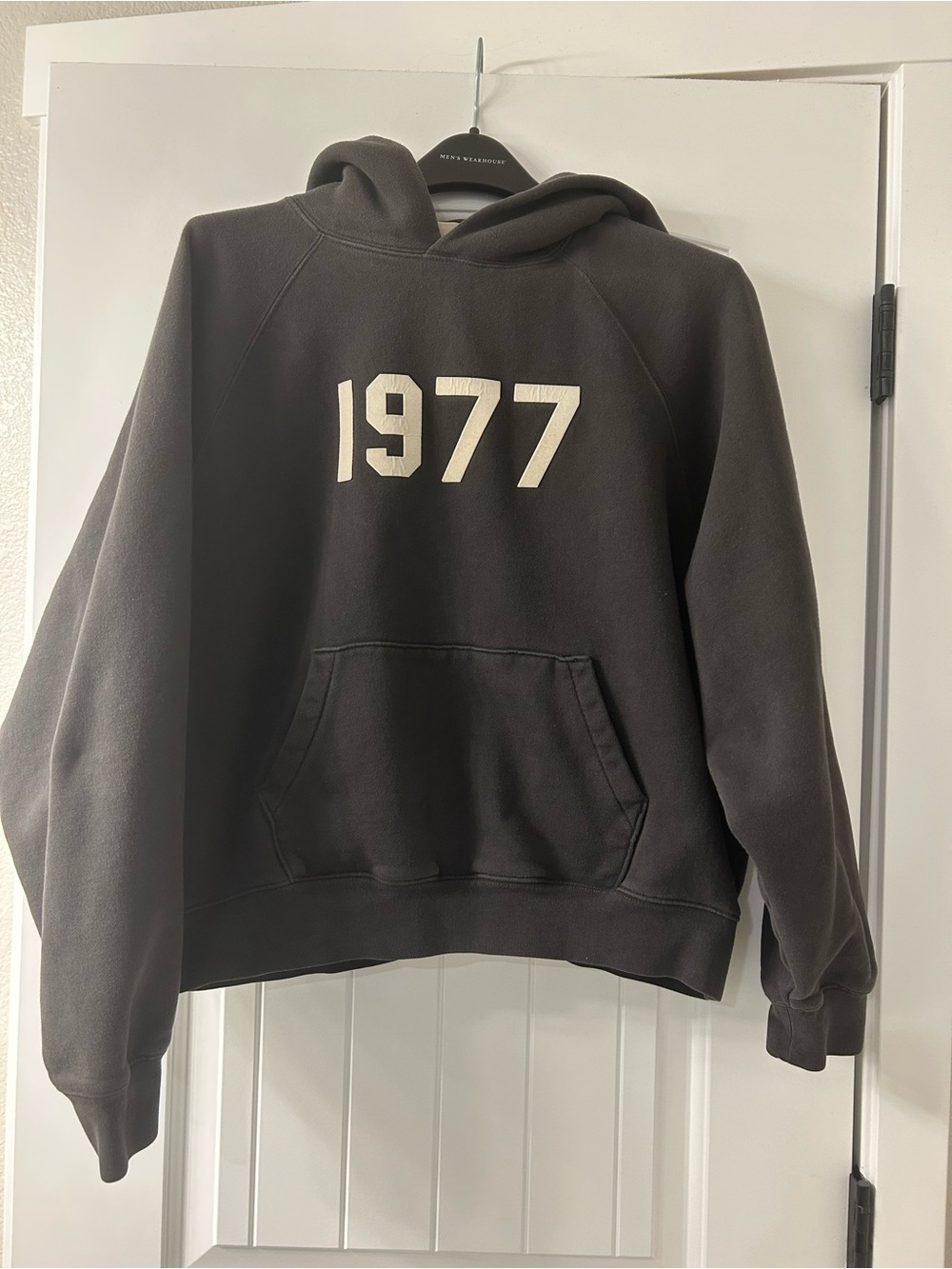 Essentials Black Crewneck Hoodie with Cream 1977 Graphic